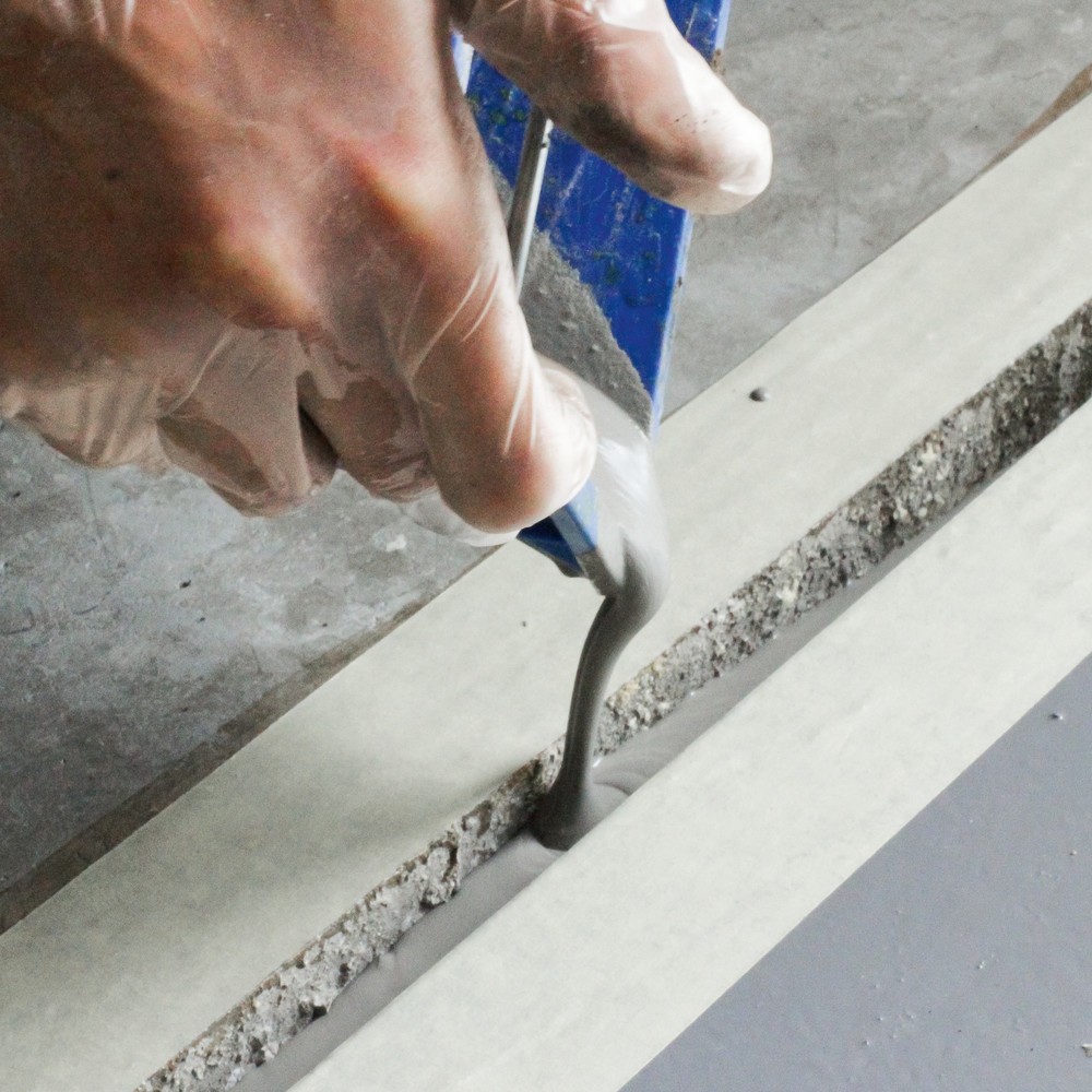 Illustration du produit: Réparation des sols pour les sols en béton, enduit fluide, 25 kg, gris